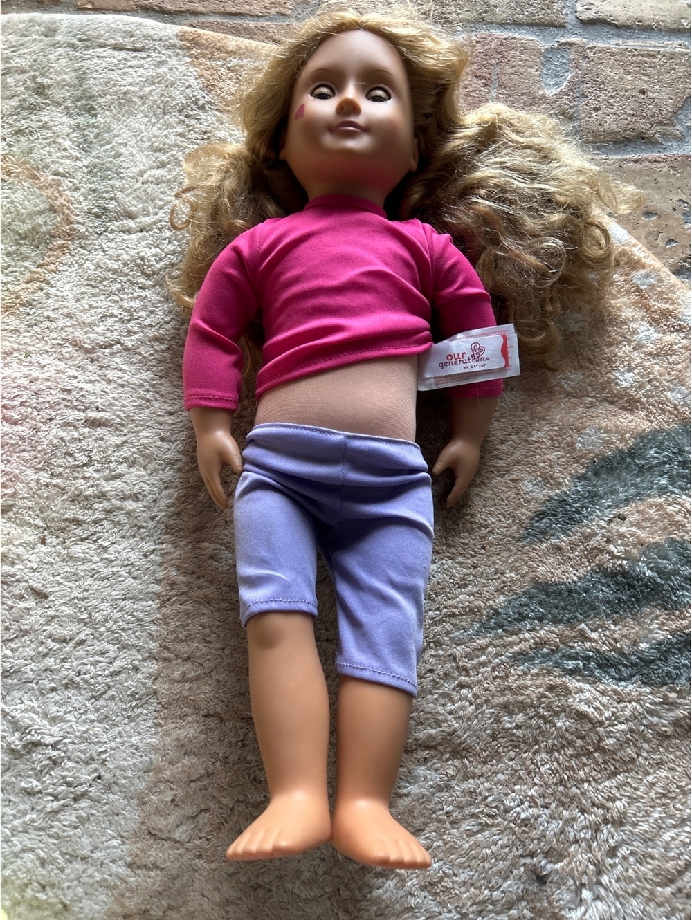 Our Generation Blonde Curly Hair Doll with Pink Top and Purple Pants